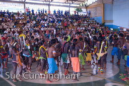 Indians dancing in the hall of the gymnasium.